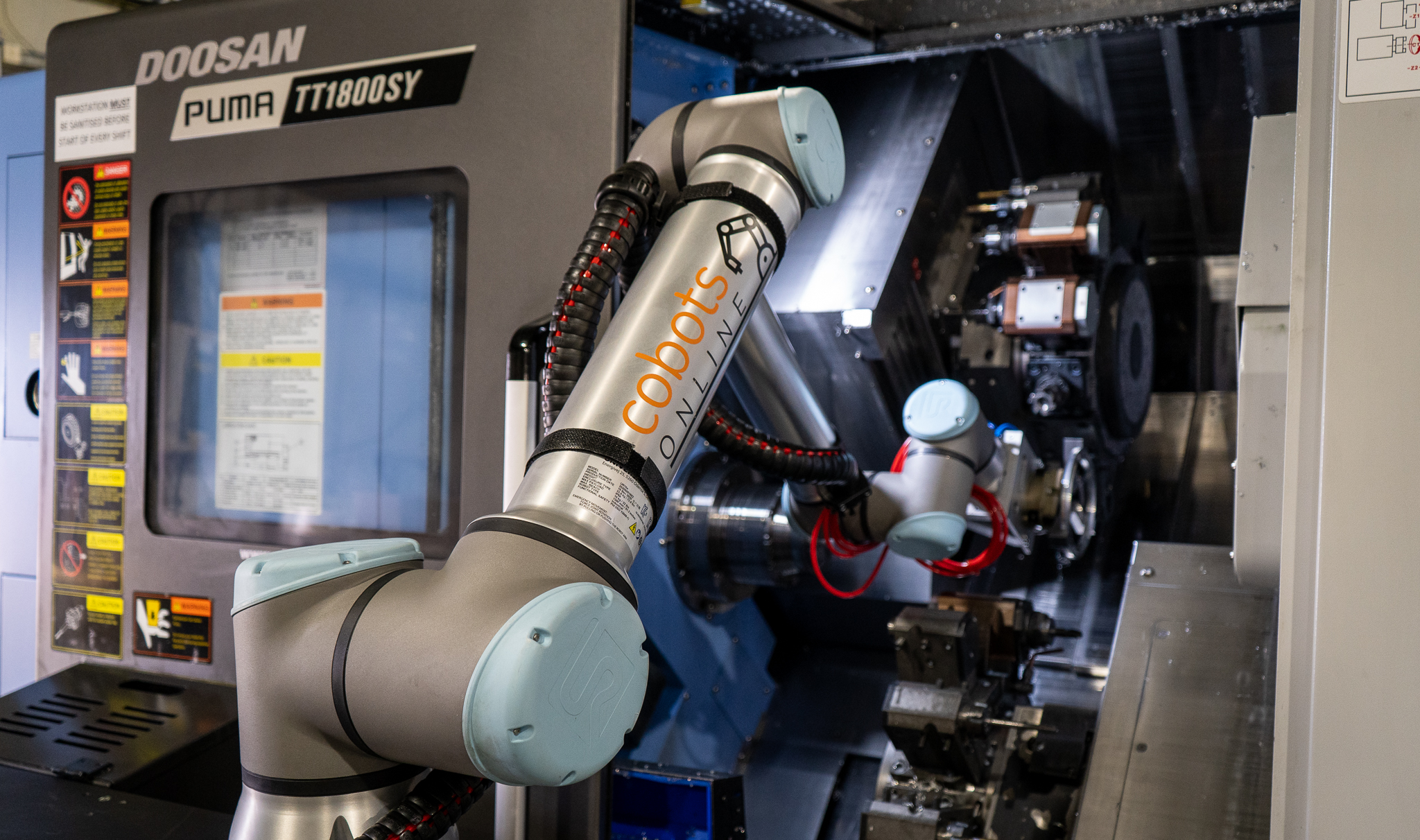 CoboTend machine tending during lights-out manufacturing